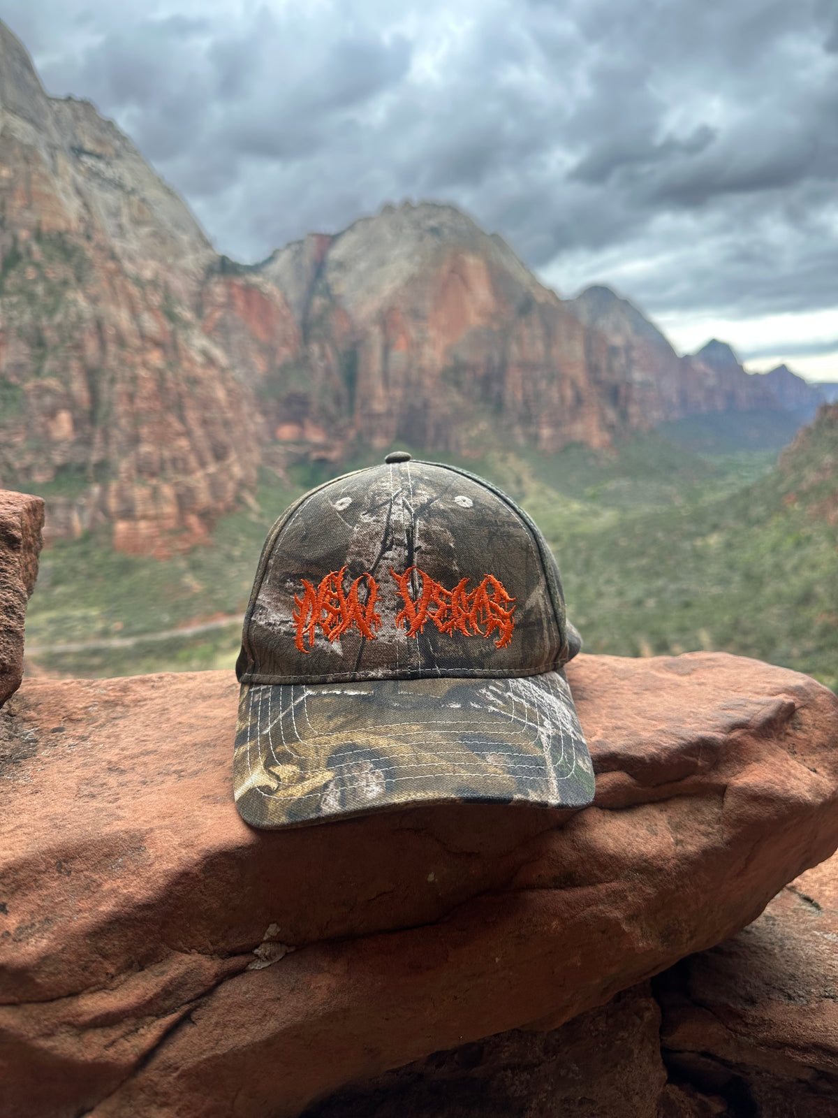 New Vegas Metal Logo (Orange) - Camo Hat (PREORDER)